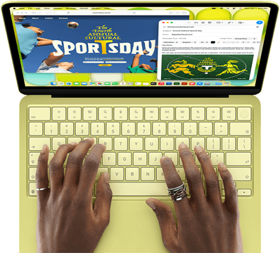 MacBook Neo, Farbe Zitrus, eine Person tippt auf der Tastatur und verfasst eine E-Mail Einladung zur Eröffnung eines Sportevents, die Website für das Event wird daneben angezeigt